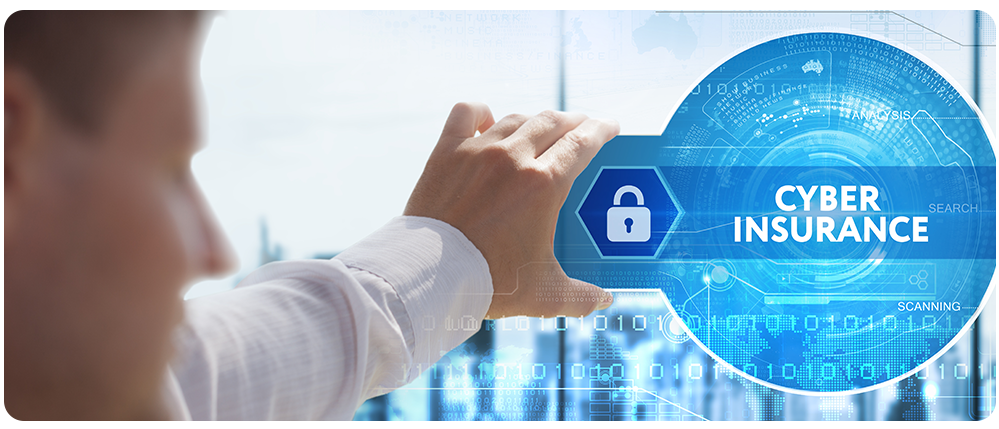 A man sitting at his desk extends his hand to hold a stylized icon of a key and lock for cyber insurance. 